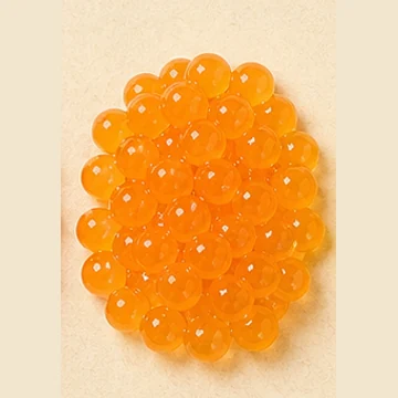 Translucent orange mango popping boba