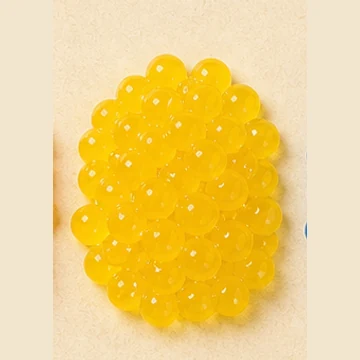 Translucent yellow passion fruit popping boba